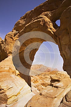 The arch from red sandstone in desert