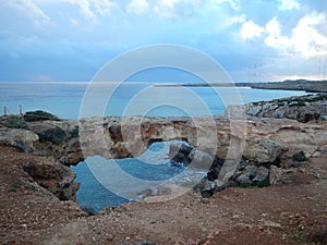 Arch of rock bridge in cavo greko in cyprus