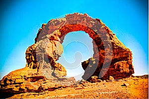 Arch Rock formation aka Arch of Africa or Arch of Algeria with moon Tassili nAjjer national park in Algeria