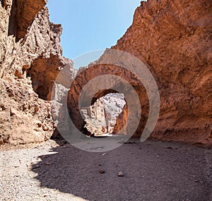 The arch rock formation of the Natural Bridge hiking trail in Death Valley National Park