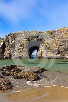 Arch in sea stacks along Oregon coast , where colonies of shore birds nest
