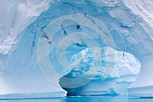 Arch Shaped Iceberg in Antarctic Waters photo