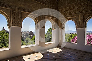 Arch-shaped windows of the historic Alhambra palace in Granada, Spain captured from the inside