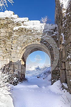 Arch of snow citadel of he ancient cave city of Mangup-Kale in the snow