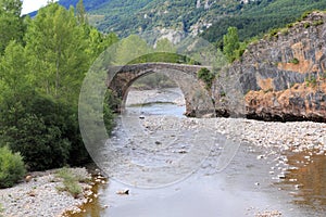 Arch stone bridge in romanesque Hecho village