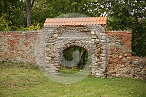 Arch in stone wall