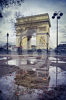 Arch of triumph and a puddle