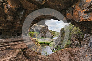 Arch tunnel natural rock cave entrance and forest view