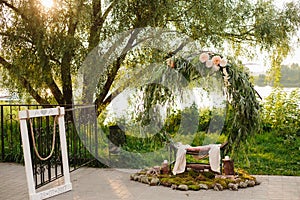 Arch for the wedding ceremony. Arch, decorated with beautiful fresh flowers and cloth.