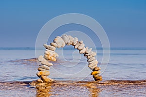 Arch of white pebbles