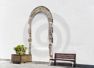 Arch on a white stucco wall