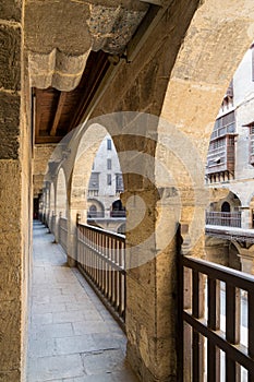 Arch with wooden balustrades, caravansary Wikala of Bazaraa, Cairo, Egypt