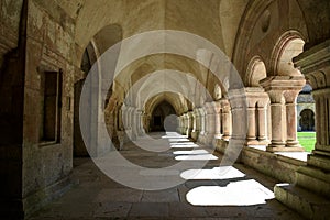 The archade of the fontenay abbey on the town of Montbard photo