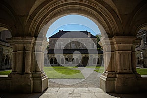 The archade of the fontenay abbey on the town of Montbard photo