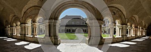 The archade of the fontenay abbey on the town of Montbard photo