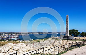 Archaeological dig at the ruins of the ancient Greek city of Panticapaeum overlooking the Obelisk of Glory to the Immortal Heroes