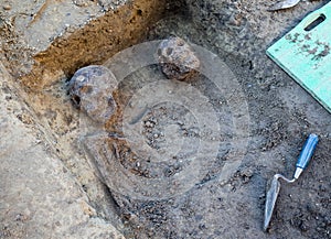 Archaeological excavation with skeletons