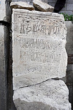 Archaeological excavations. Old stone slabs with old Slavonic inscriptions