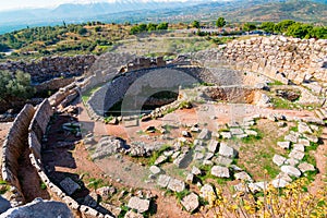 The archaeological site of Mycenae near the village of Mykines, with ancient tombs, giant walls and the famous lions gate.