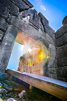 The archaeological site of Mycenae near the village of Mykines, with ancient tombs, giant walls and the famous lions gate.