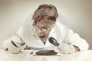 Archaeologist researcher taking samples of cuneiform material