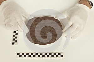 Archaeologist researcher taking samples of cuneiform material