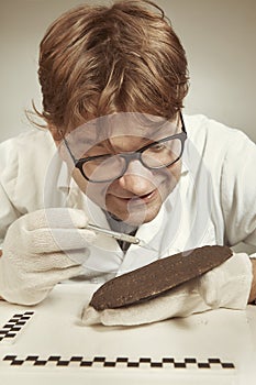 Archaeologist researcher taking samples of cuneiform material