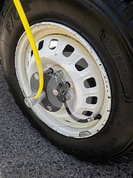 archaic yellow air tube system on the exterior of a vehicle to control tire pressure in off-road vehicles