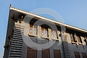 Archaised Chinese traditional building against blue sky in sunny
