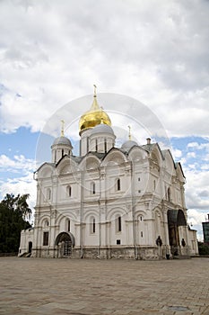 Archangel Cathedral in the Kremlin against the background of white clouds on a clear sunny day, Moscow. Sights of Russia