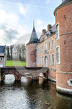 Arched bridge over moat surrounding 16th century Alden Biesen castle