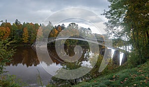 Arched bridge over Ogre river .