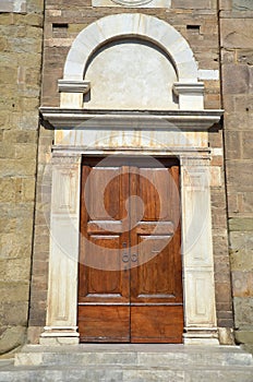 Arched church door in Lucca, Italy