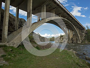 Arched Concrete Bridge Over a Rushing River, Alberta, Canada