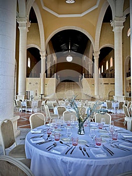 Arched Dining Hall with Natural Light and Rustic Charm photo