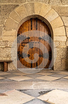 Arched door inside historic monastery in Guimaraes