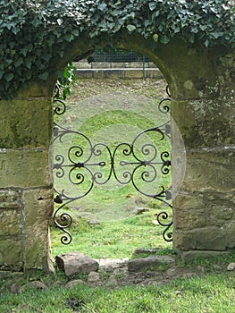 Arched doorway in old brick wall