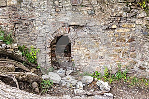 Arched doorway in the old wall of the fortress