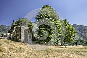 Arched entrance with a carved stone cross in the Haghpat Monastery