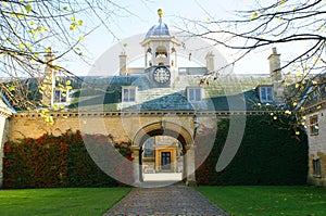 Arched entrance, domed clock tower, and dormer windows