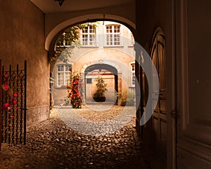 Arched entrance to courtyard on old European building