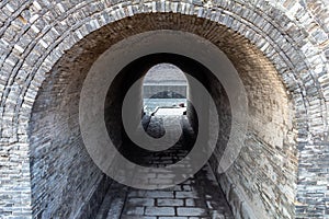 Arched entry in the ancient walls protecting the Old city of Pingyao, China.