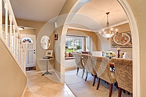 Arched entry to elegant Formal dining room