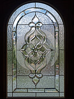 Arched leaded glass inlay in a door