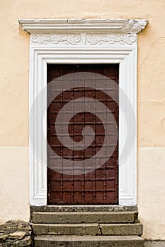 Arched medieval church door with stone lintel photo