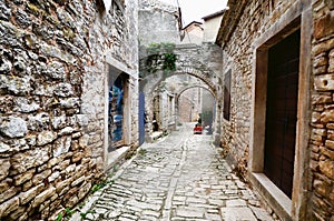 Arched medieval street in an old village in Istria, Croatia