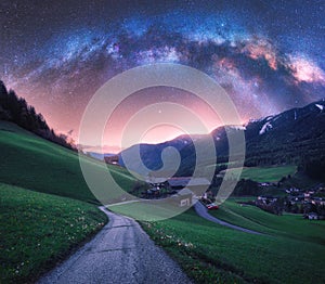 Arched Milky Way over the rural mountain road in summer in Italy