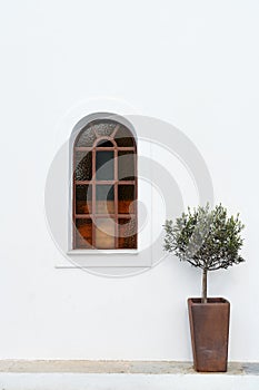 Arched Stained Glass Window on White Wall