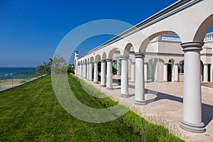 Arched structure with columns architecture with a flower bed of lavender.