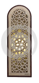 Arched stucco window decorated with illuminated stain glass with geometrical patterns, a Mamluk era tradition photo